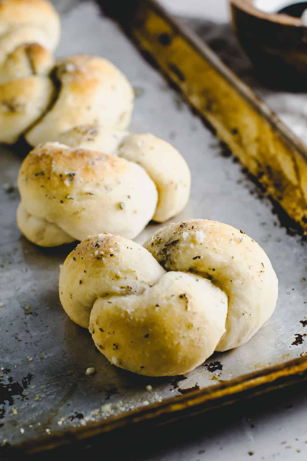 Parmesan knots on a baking sheet