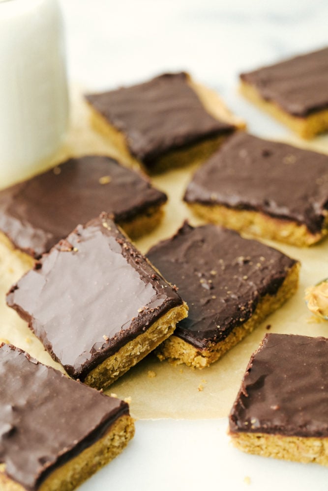 Peanut butter bars sliced up and sitting in the photo. 