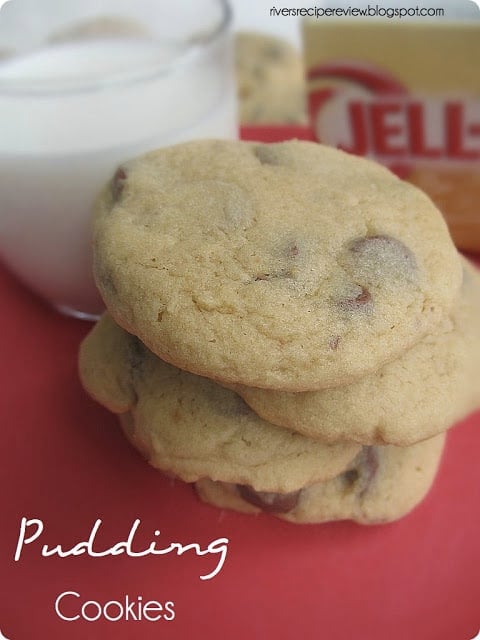 Pudding cookies stacked with a glass of milk.