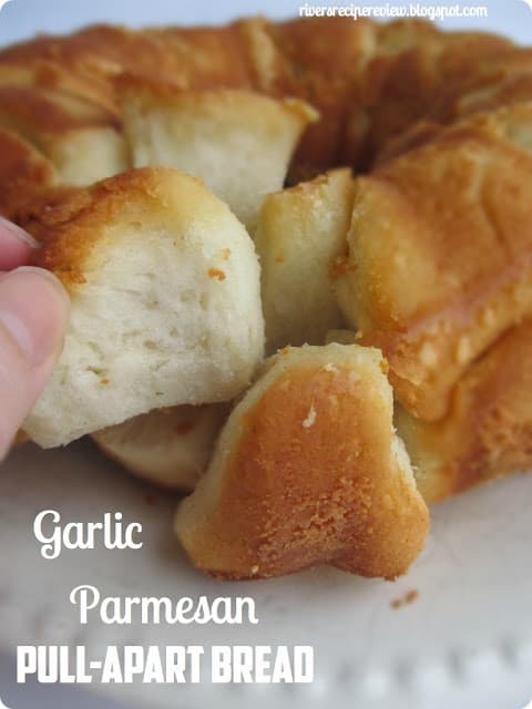 Garlic Parmesan Pull-Apart Bread being pulled apart.