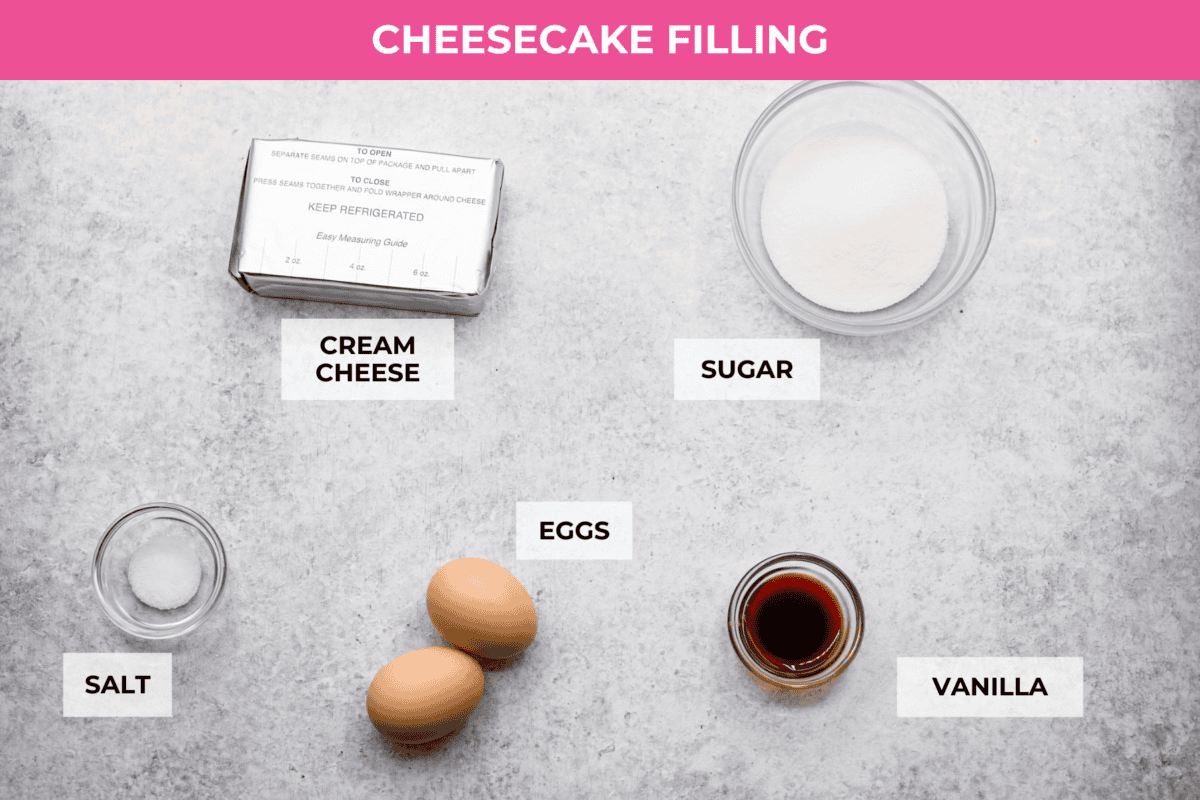 Overhead shot of labeled cheesecake filling ingredients. 