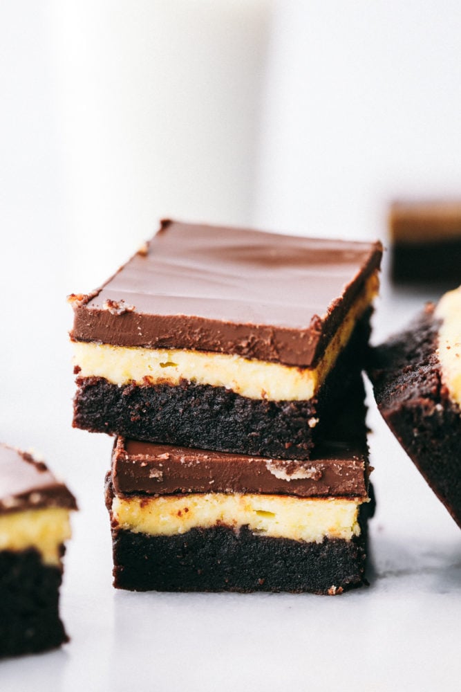 Hershey chocolate cheesecake brownies stacked on top of each other. 