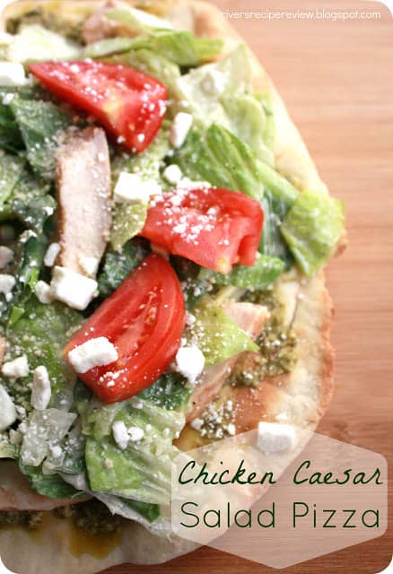 Chicken Caesar salad pizza on a butcher block. 