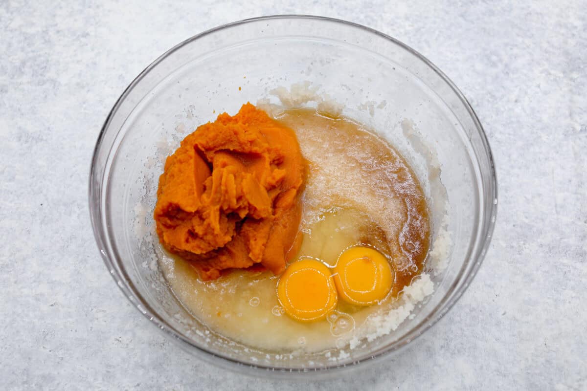 Overhead shot of wet ingredients in a glass bowl. 