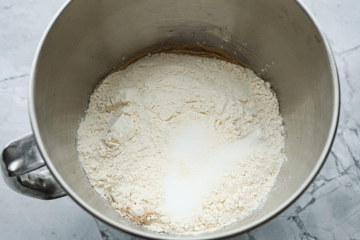 Overhead shot of dough ingredients in a mixing bowl. 