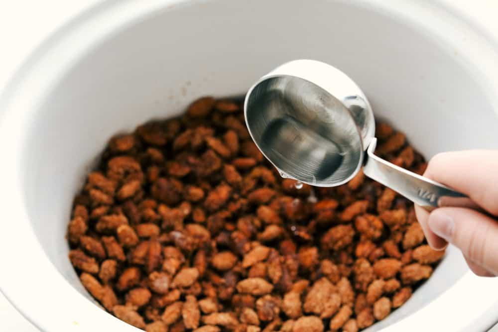 Putting water in the almonds towards the end of cooking. 