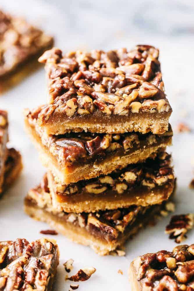 Pecan Pie Bars stacked on top of one another. 