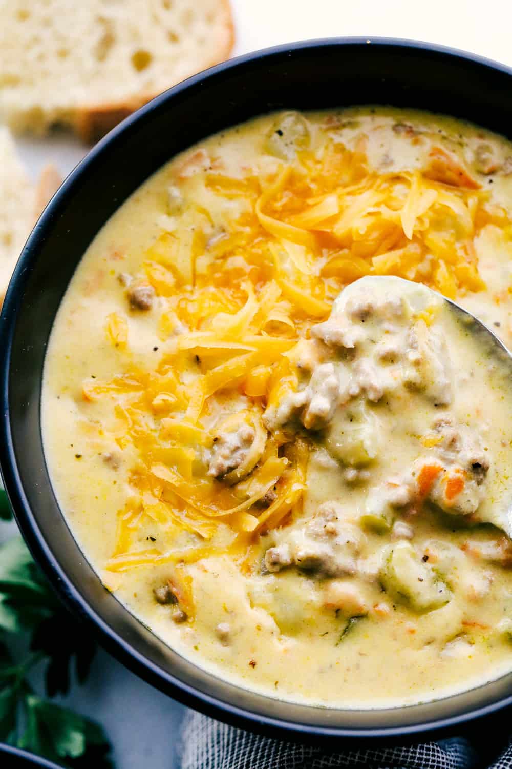 Cheeseburger soup with a spoon.
