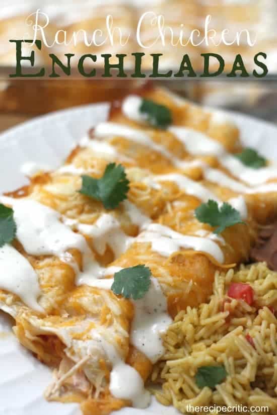 Ranch chicken enchiladas on a white plate with rice on the side. 