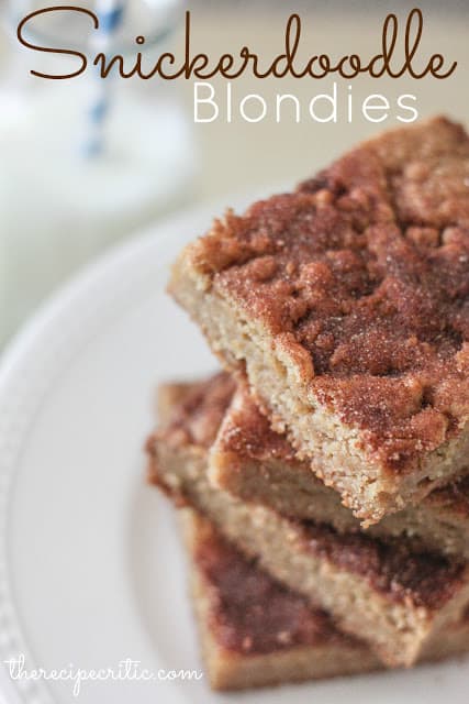 A stack of 4 snickerdoodle blondies on a white plate.