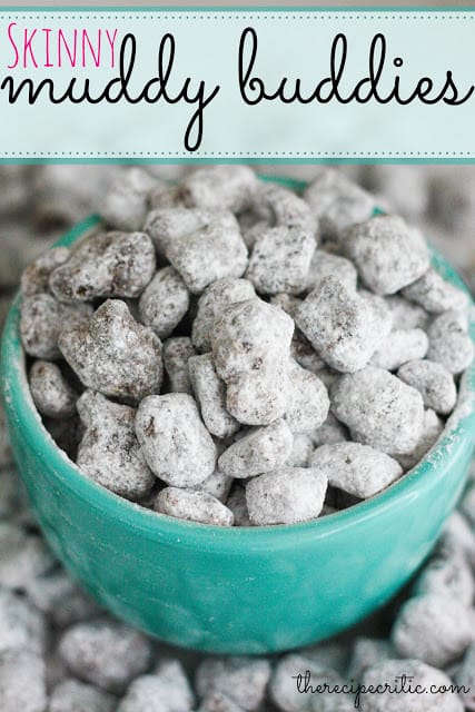 Skinny muddy buddies in a teal bowl and overflowing onto the table.