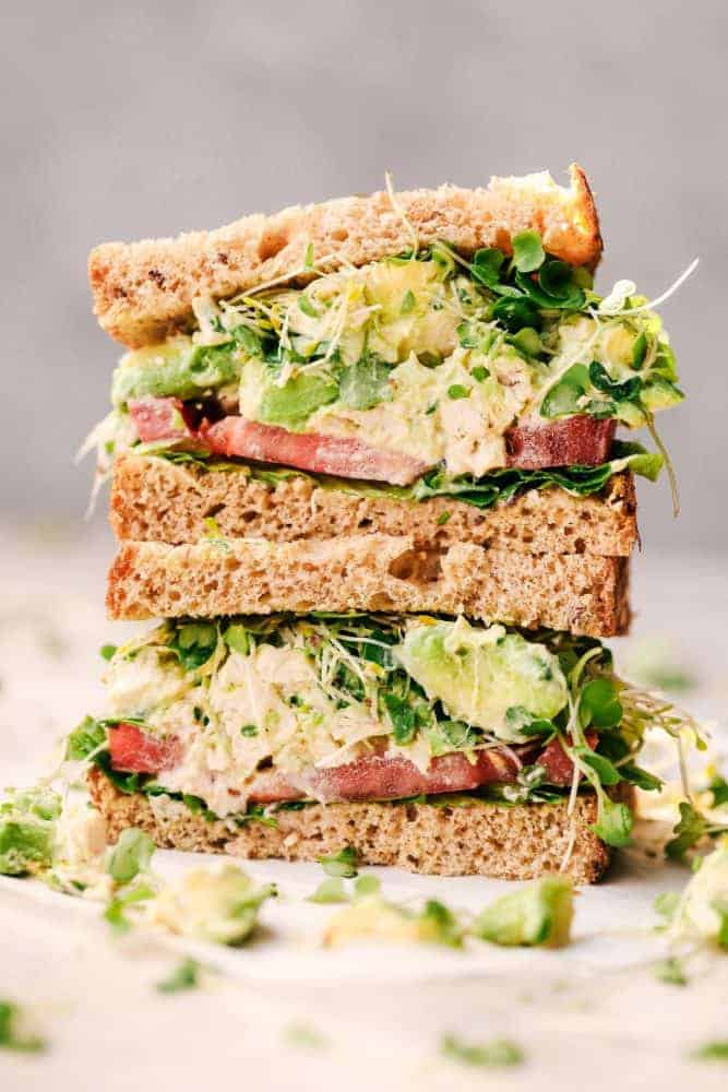 Avocado Chicken Salad sandwich cut in half and stacked. 