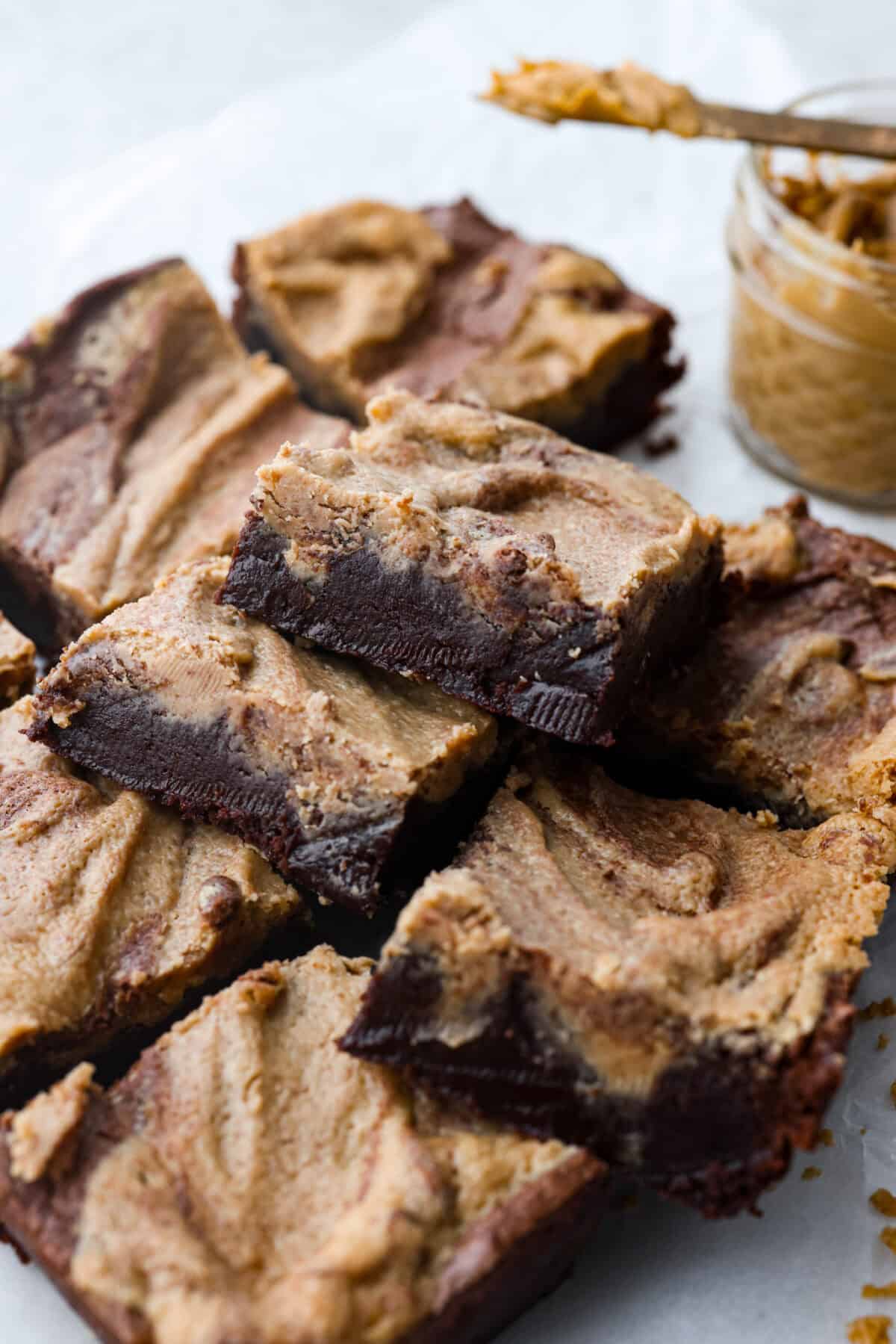 Close side view of a small stack of peanut butter brownies.