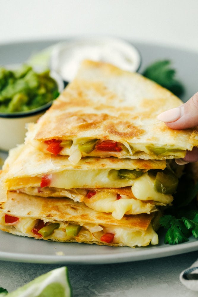 Fajita Style Quesadillas are sauted peppers and onions with melted cheese in a crisp tortilla. 