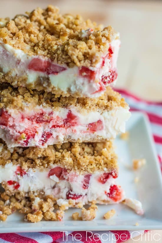 3 Strawberries and cream dessert bars on a white plate,
