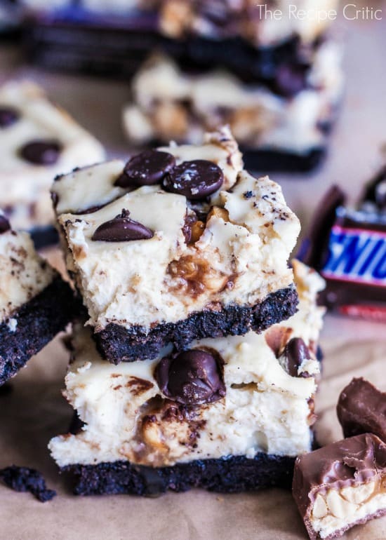 Stack of 2 snickers cheesecake bars.