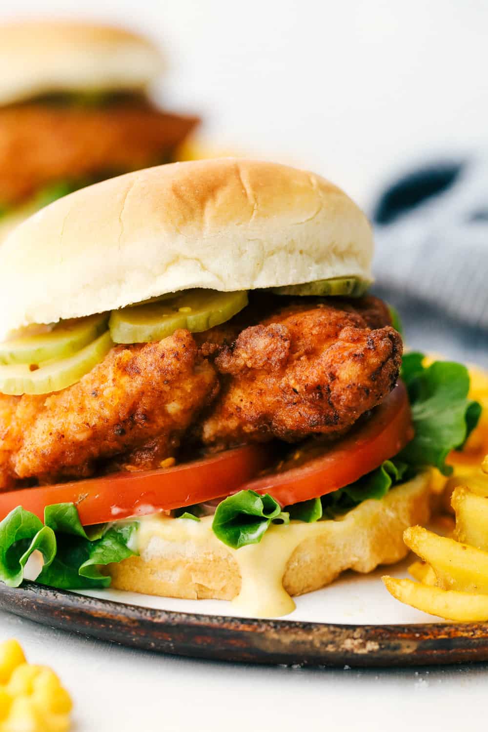 Chicken Sandwich with pickles and chick-fil-a sauce on a plate. 