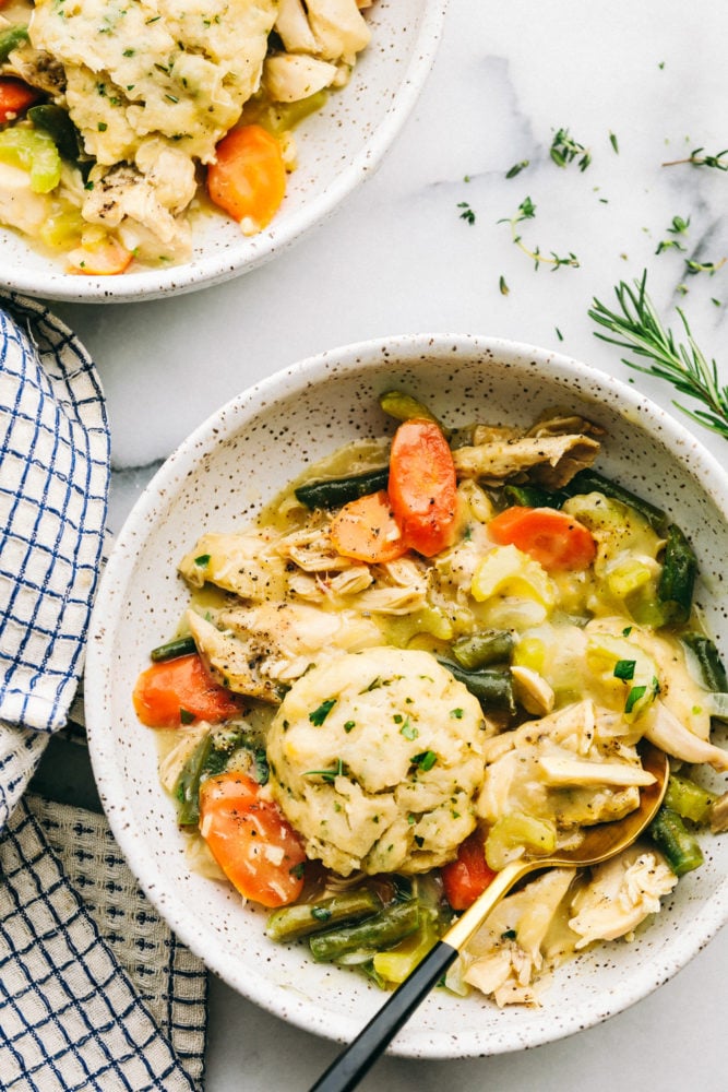 Chicken and dumplings with carrots and asparagus.