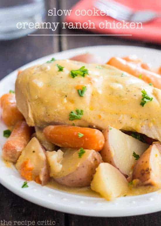 Slow cooker creamy ranch chicken with potatoes and carrots on a plate.
