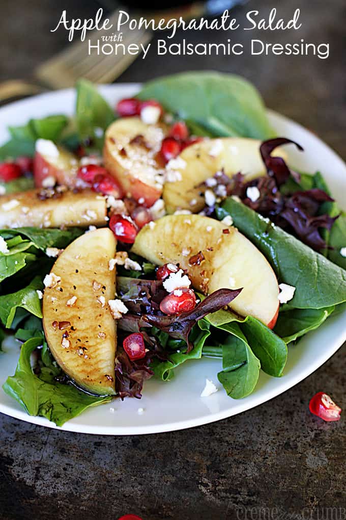 Apple Pomegranate Salad with Honey Balsamic Dressing on a white plate.