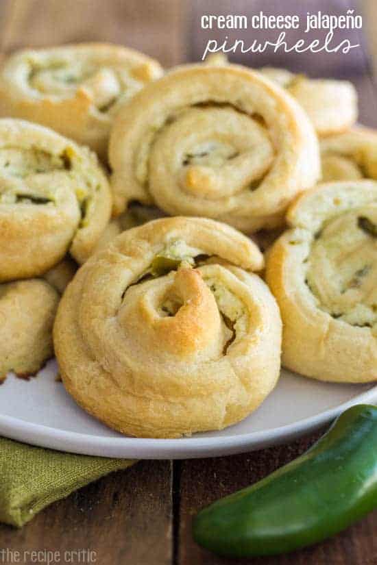 Cream Cheese Jalapeño Pinwheels on a white plate with an un-cute jalapeño on the side.