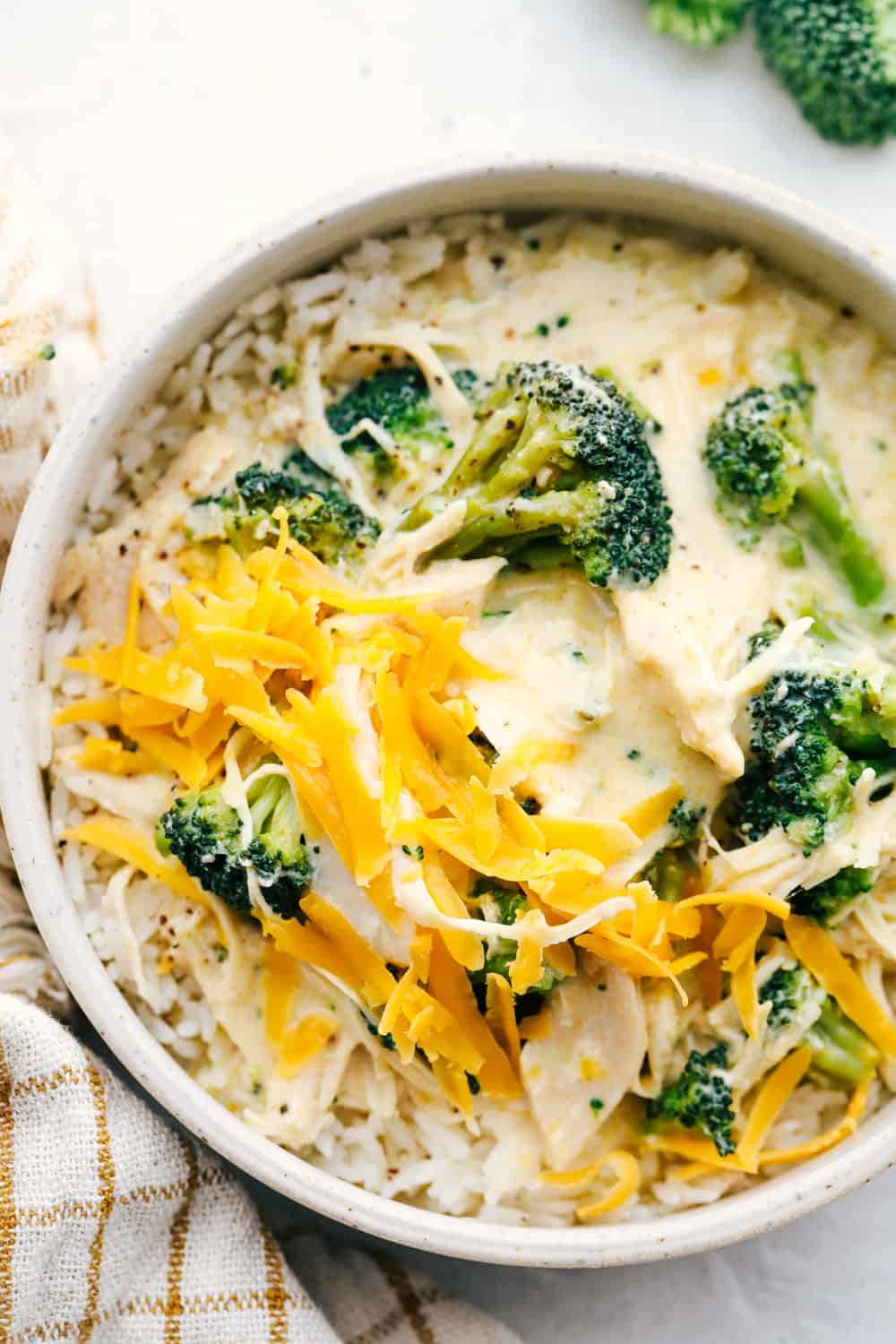 Delicious Slow Cooker Creamy Chicken and Broccoli over Rice.