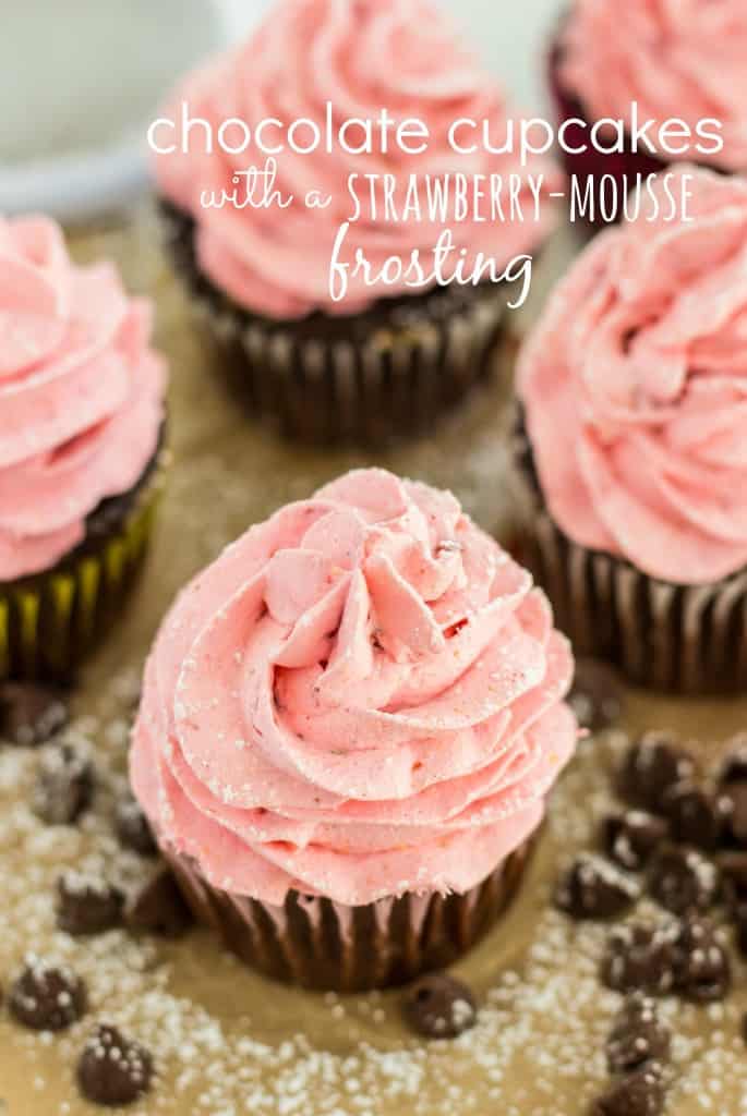 Strawberry Mousse frosted double chocolate Cupcakes on a table. 