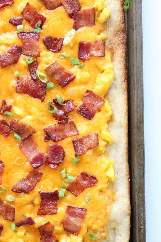 Closeup overhead photo of Bacon and Cheddar Breakfast Pizza. 