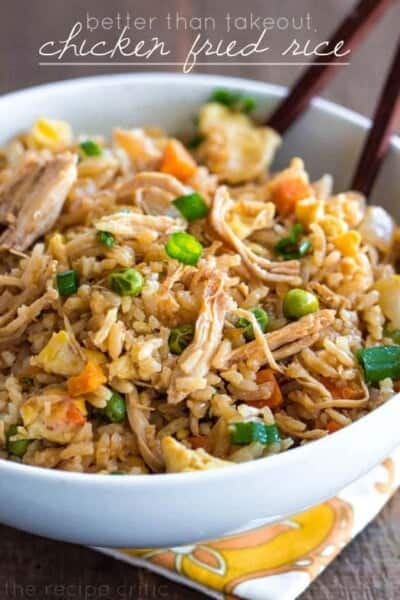 Chicken Fried Rice in a white bowl with wood chopsticks. 