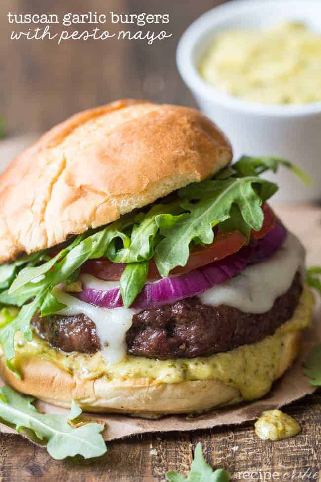 Tuscan Garlic Burger with Pesto Mayo on a wooden table. 