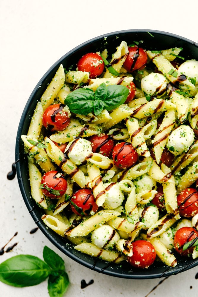 Caprese Pasta Salad in a black bowl. 