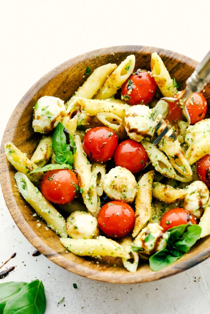 Caprese Pasta Salad in a wood bowl. 