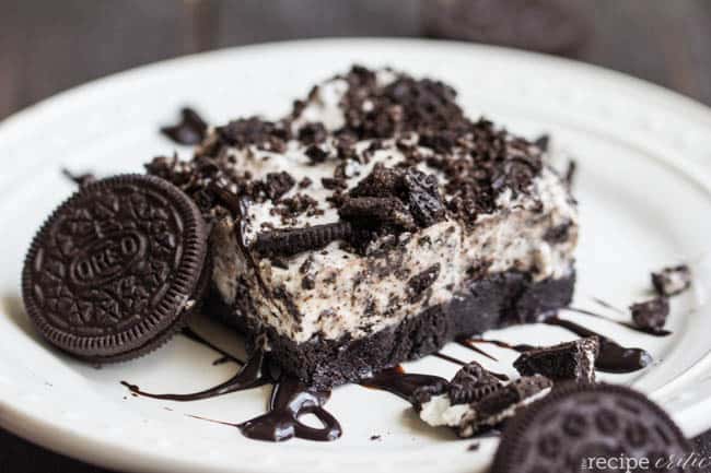 Frozen cookies and cream brownie dessert soon a white plate. 