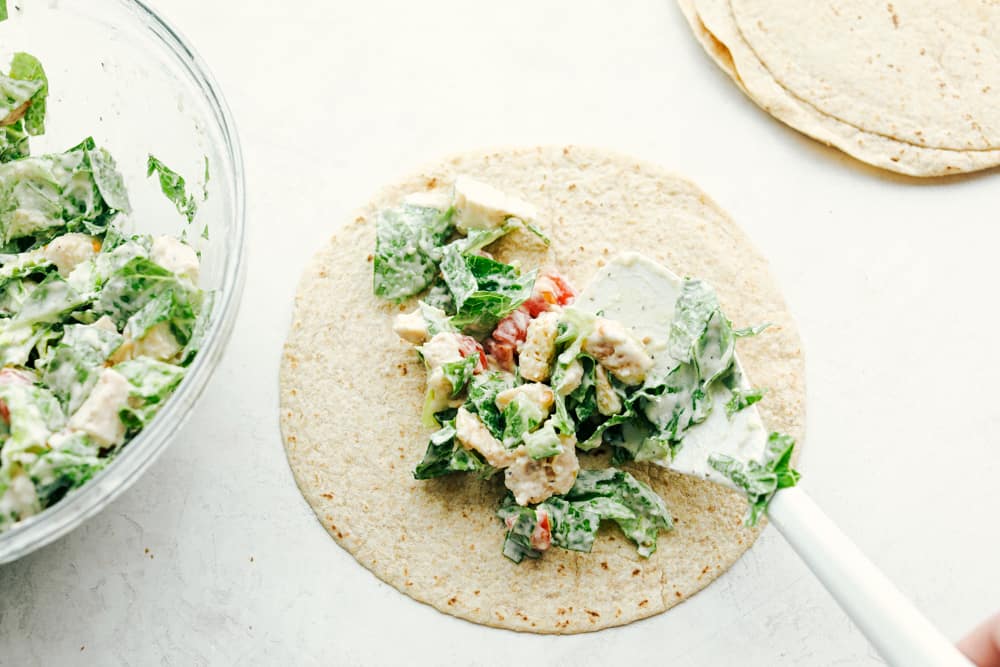 Overhead view of a open chicken caesar wrap.