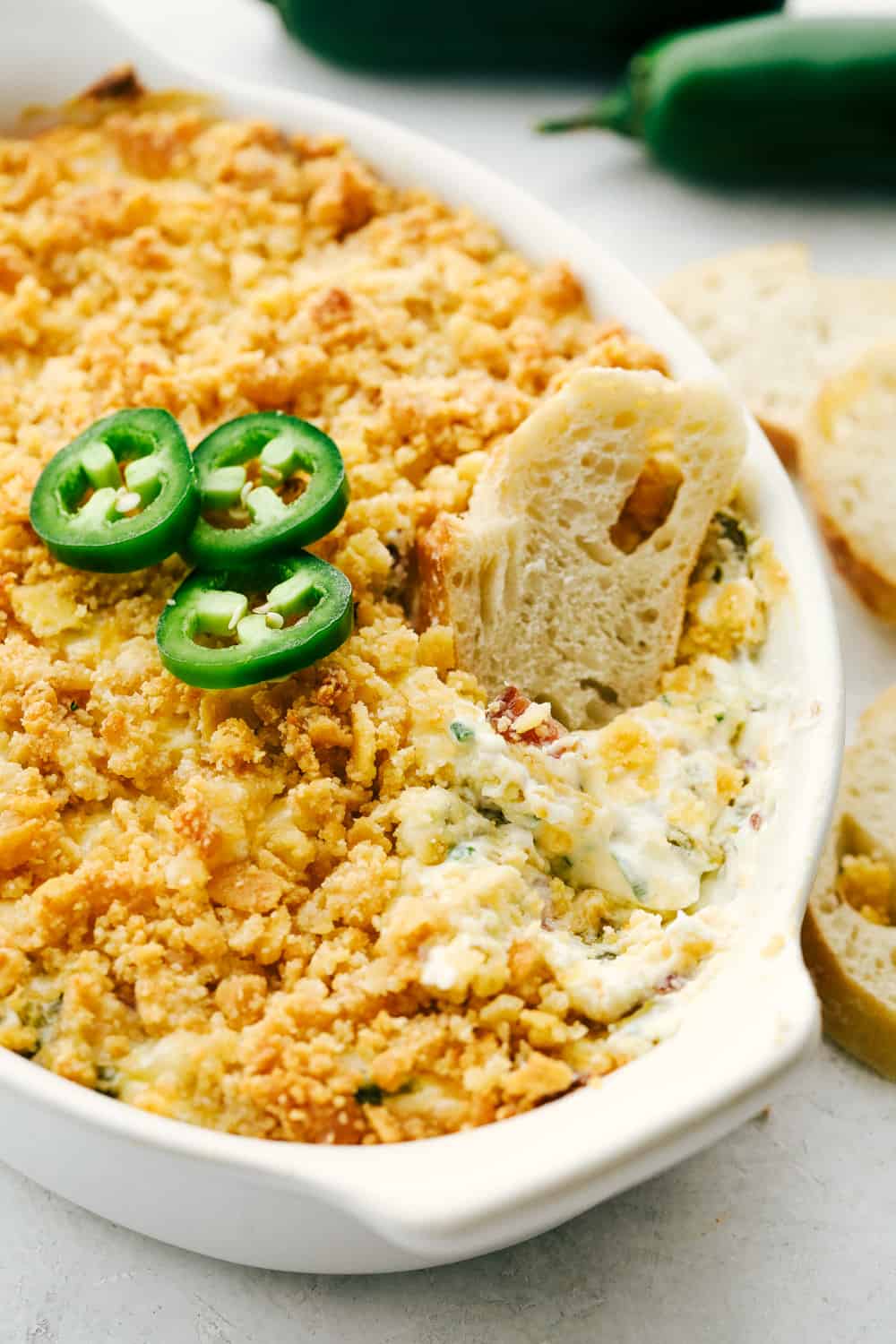 Creamy, spicy jalapeno dip with bread for dipping.