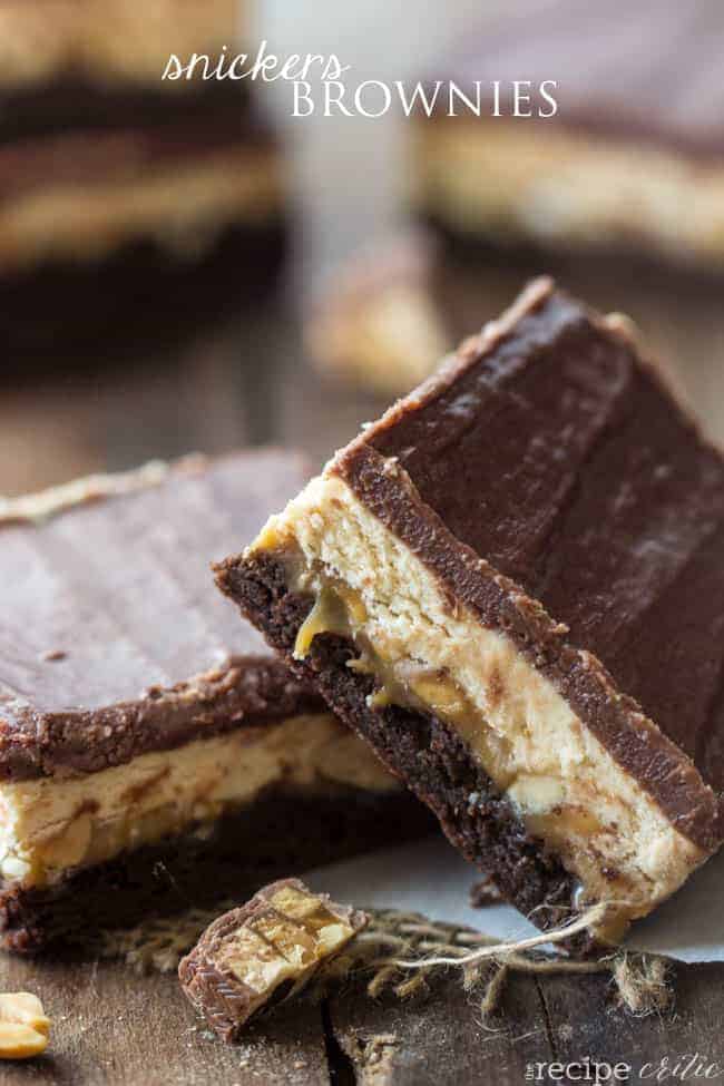 Snickers brownies stacked on top of each other. 