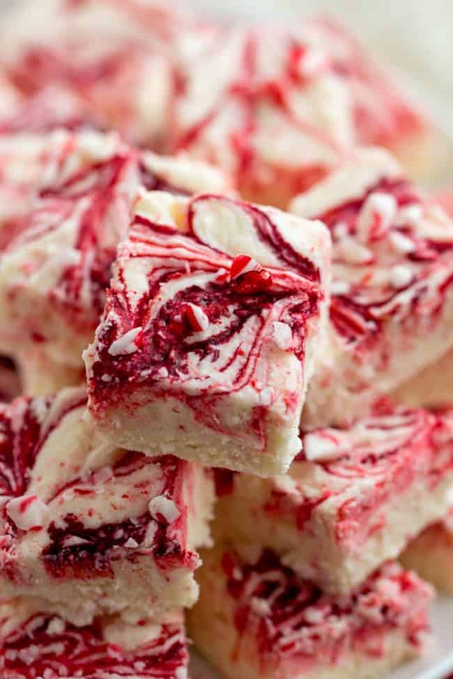 Peppermint swirl fudge stacked on top of each other. 