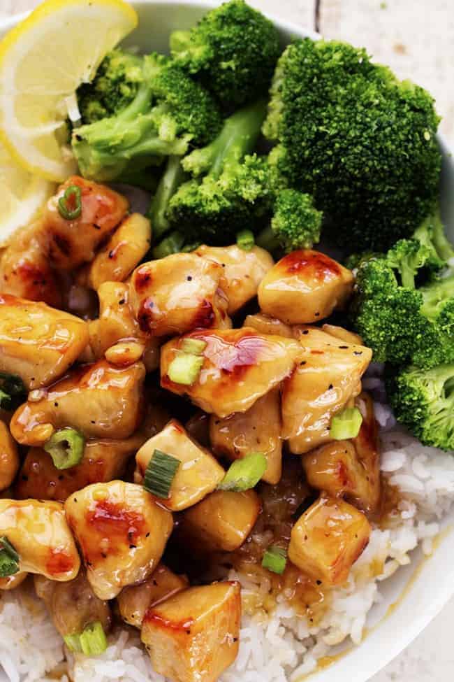 Honey lemon ginger chicken plated with rice and broccoli.