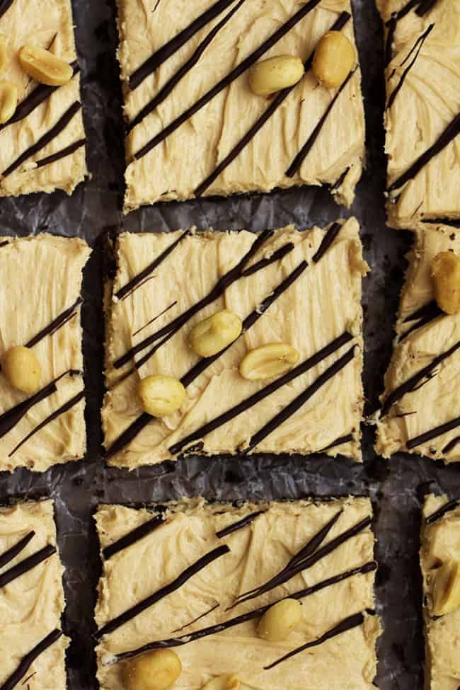 Peanut butter cheesecake squares on a tray.