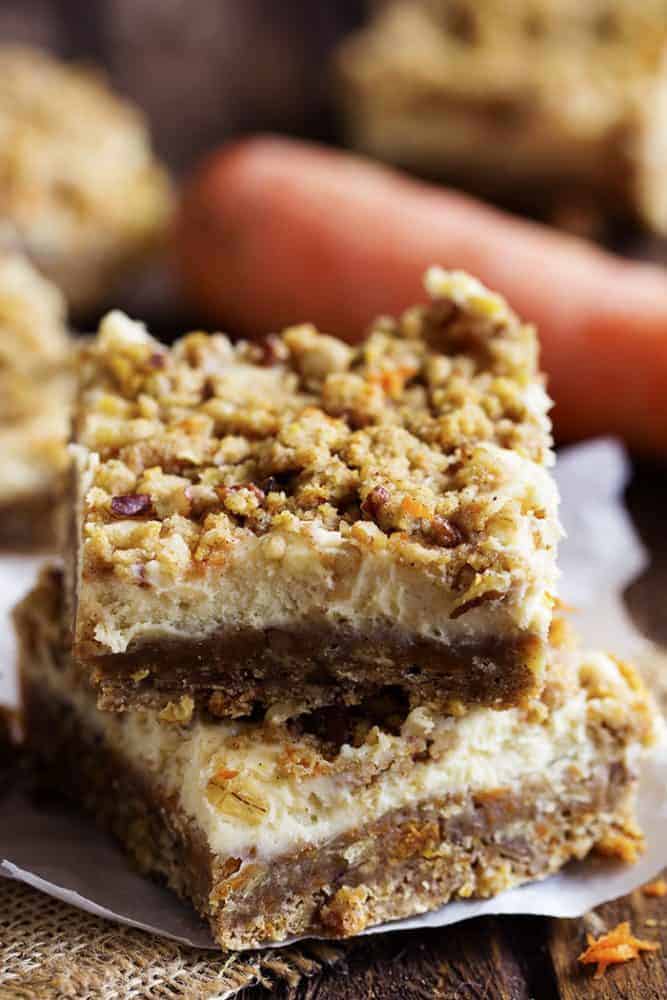 carrot cake cheesecake bars in a stack.