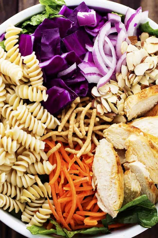 chicken chicken pasta salad ingredients on a white plate