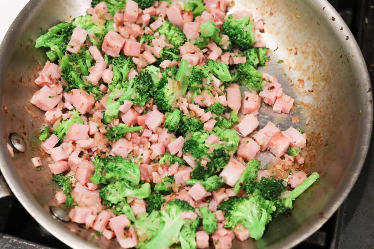 Overhead shot of ham with the broccoli and shallot mixture.