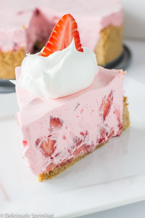 Slice of no Bake Strawberry and Cream Pie on a white plate.