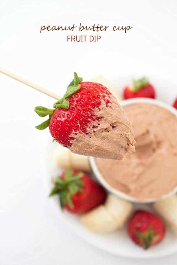 A strawberry dipped in peanut butter cup fruit dip.