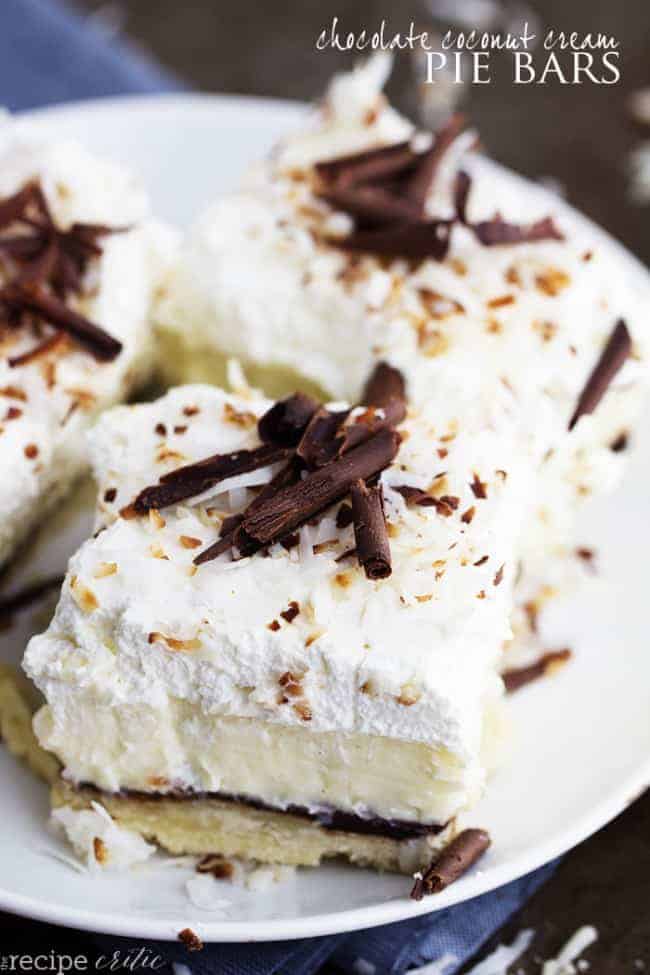 Chocolate coconut cream pie bars on a white plate.