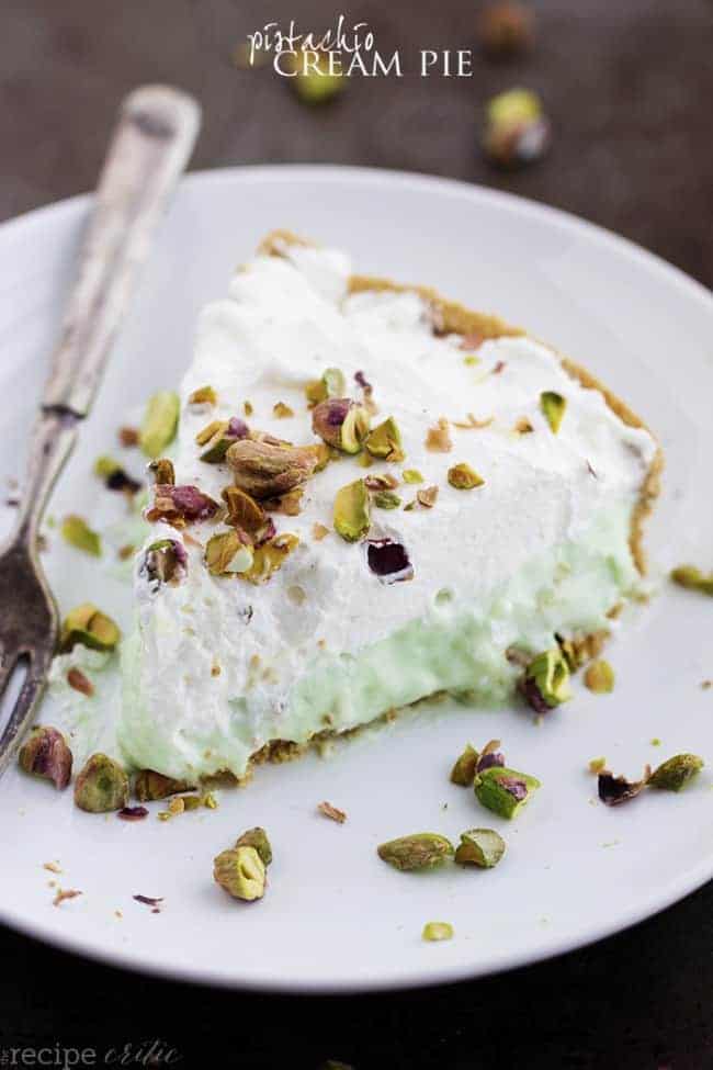 Slice of pistachio cream pie on a white plate.