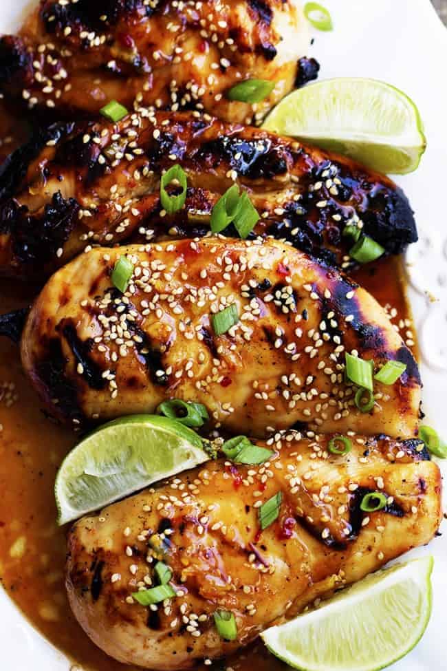 sweet chili lime chicken areal view with lime and sesame seed garnish.