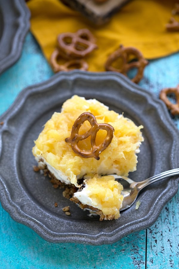 Easy Pineapple Pretzel Salad square on a blue plate.