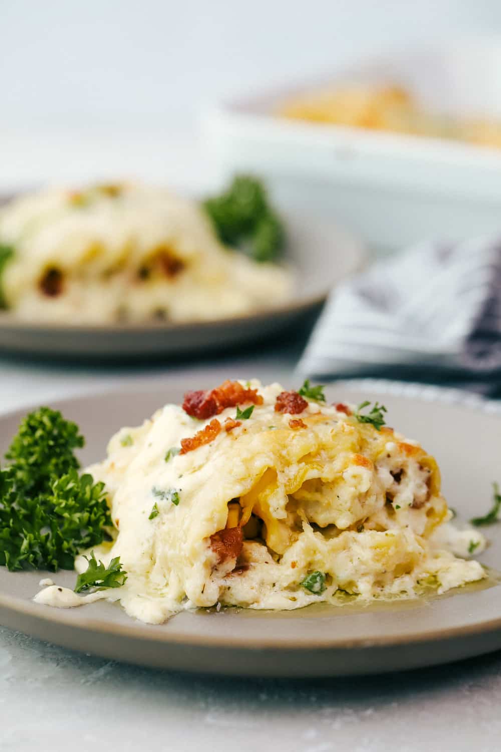 Chicken Bacon Garlic Alfredo Roll ups on a plate. 