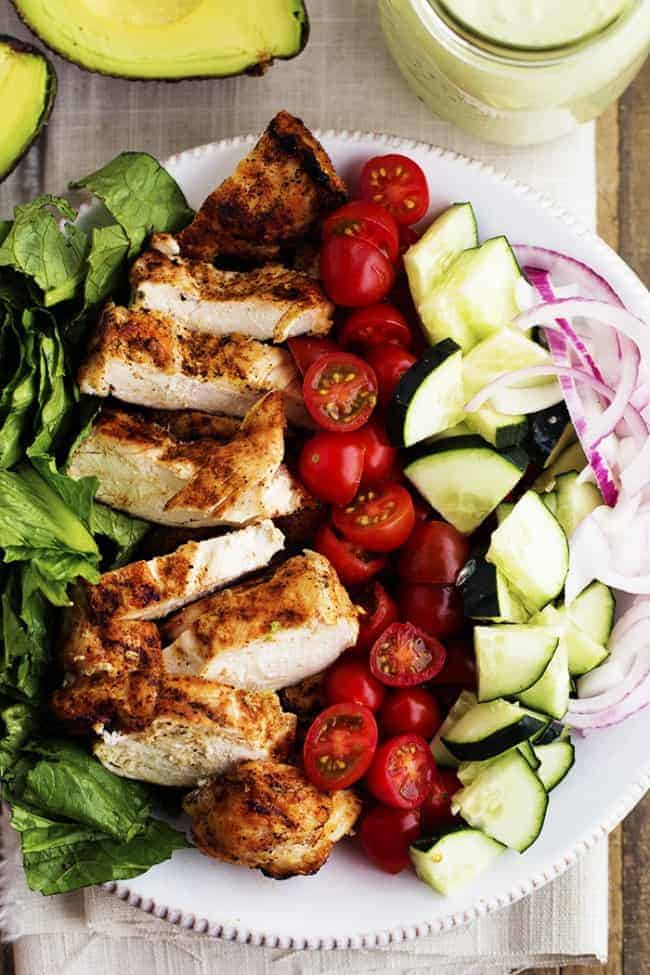 cajun chicken salad ingredients on a white plate.